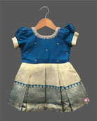 Baby girl silk blend traditional frock featuring zari border and puff sleeves for cultural events