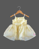Baby party wear dress featuring satin rosette appliqués, embellished shoulder straps, and a flared organza skirt.