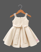 Silk frocks for baby girl featuring structured box pleats and dimensional fabric rosettes on straps