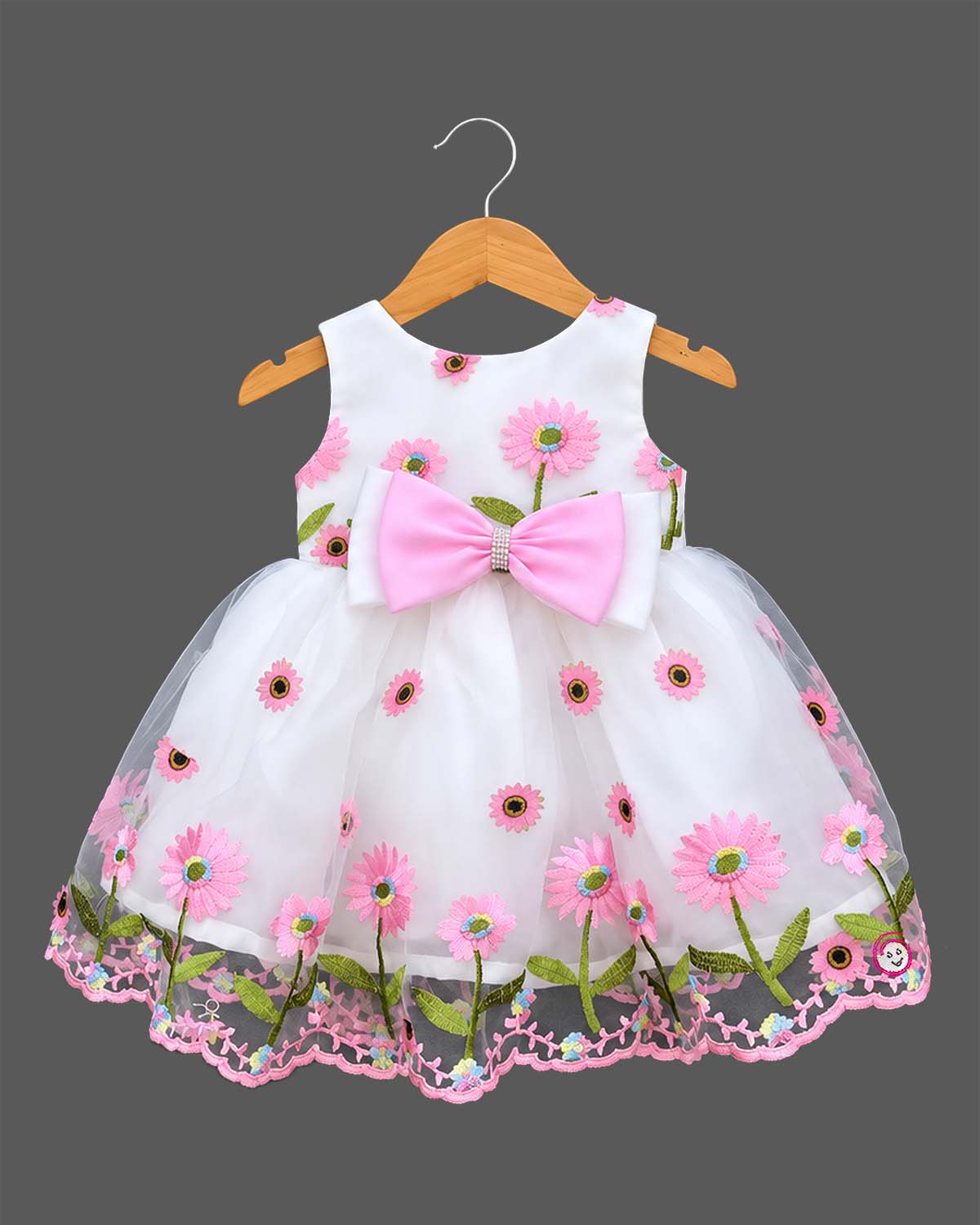 Toddler sleeveless floral embroidered tulle frock featuring a large front waist bow and flared mesh skirt overlay.