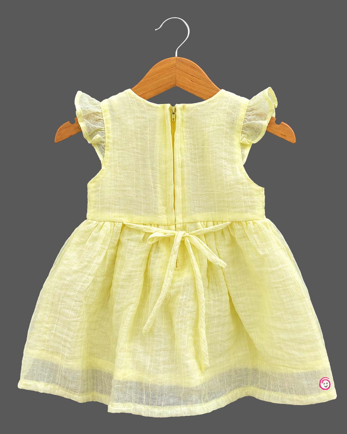 Frill sleeve organic casual frock with embroidered floral vines and baby casual wear dress styling details.