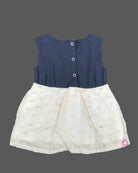 Traditional festive frock for baby girls featuring a sleeveless yoke with golden embroidery and a shimmering tissue skirt, perfect for Onam celebrations.