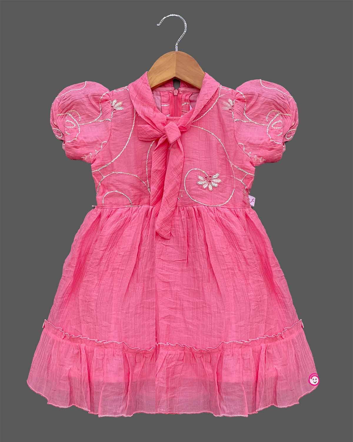 Pink georgette frock with white embroidery and puff sleeves for baby girls