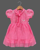Pink georgette frock with white embroidery and puff sleeves for baby girls