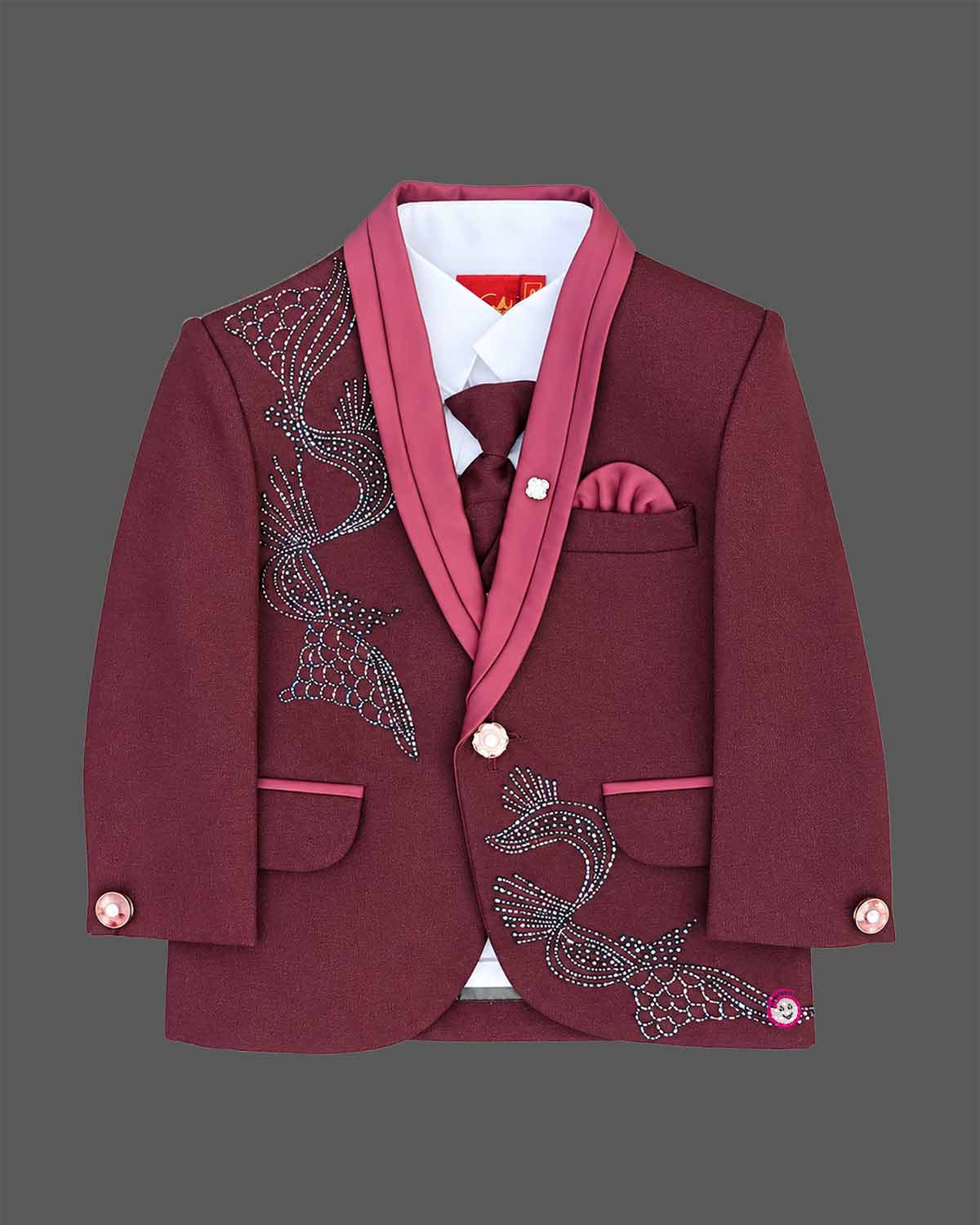 Maroon formal suit for little boys featuring a blazer with black and silver sequin details, a grey collar accent, white shirt, black tie, and matching maroon pant against a grey background.