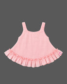 Infant cotton ruffle top with frill hemline and decorative charm detail for baby girl party wear
