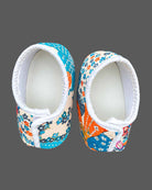 Toddler wearing an asymmetric floral print kids dhoti kurta with mandarin collar and pleated bottoms.