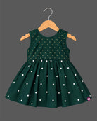 Sleeveless pattu frock with woven yoke detail and pleated floral flare for baby girls.