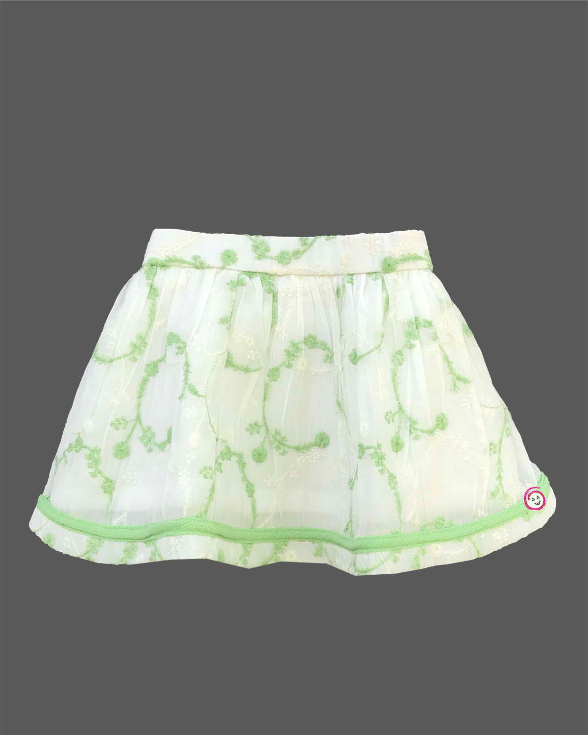 Charming top and skirt set for little princess featuring a multi-tiered ruffled strap top paired with a delicate embroidered net skirt on a hanger.