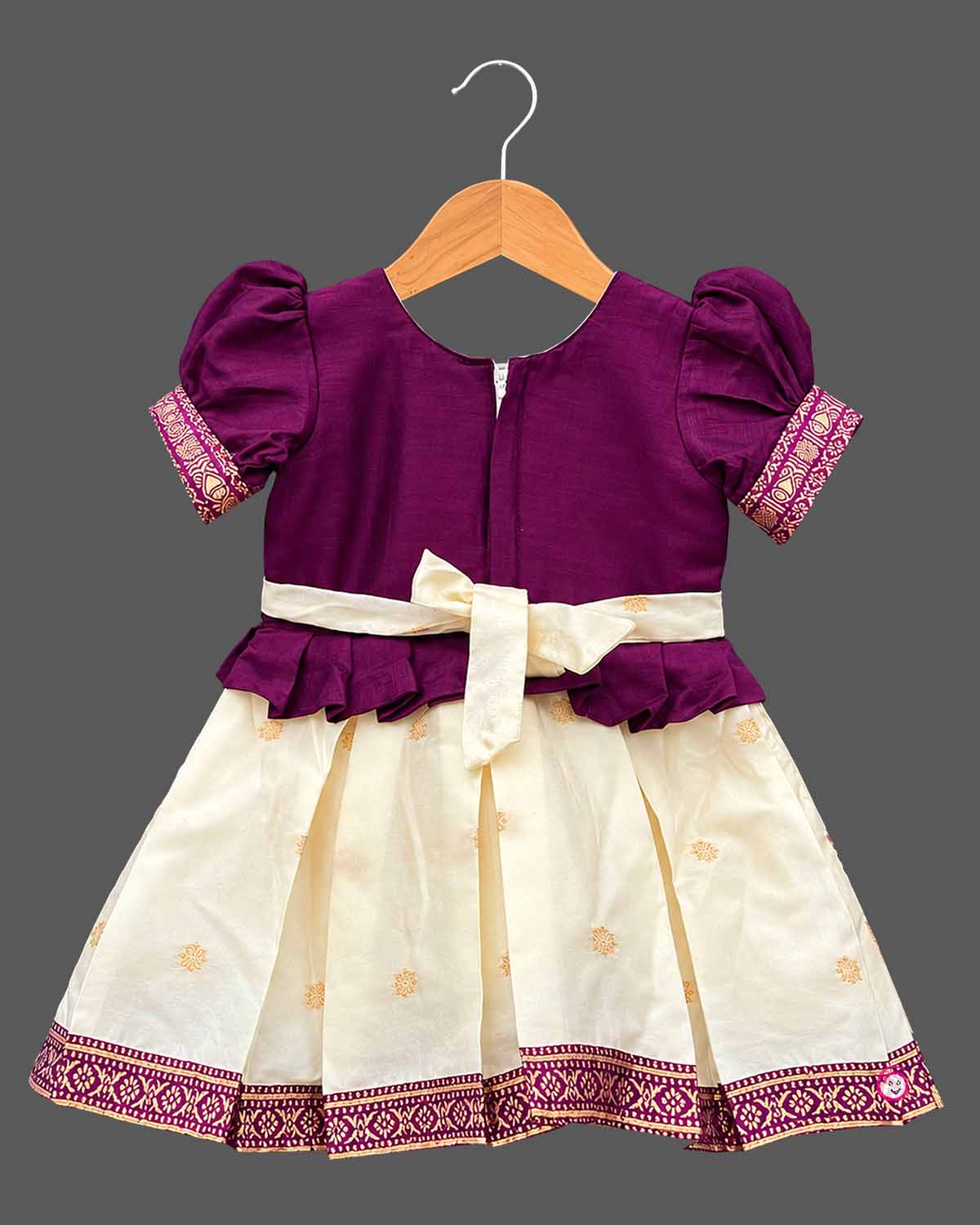 Toddle silk cotton frock  for kids featuring embroidered  puffed sleeves, and woven pleated skirt.