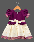 Toddle silk cotton frock  for kids featuring embroidered  puffed sleeves, and woven pleated skirt.
