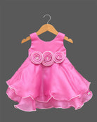 Sleeveless satin tiered party frock featuring three beaded rosettes at the waist and scalloped layered hem