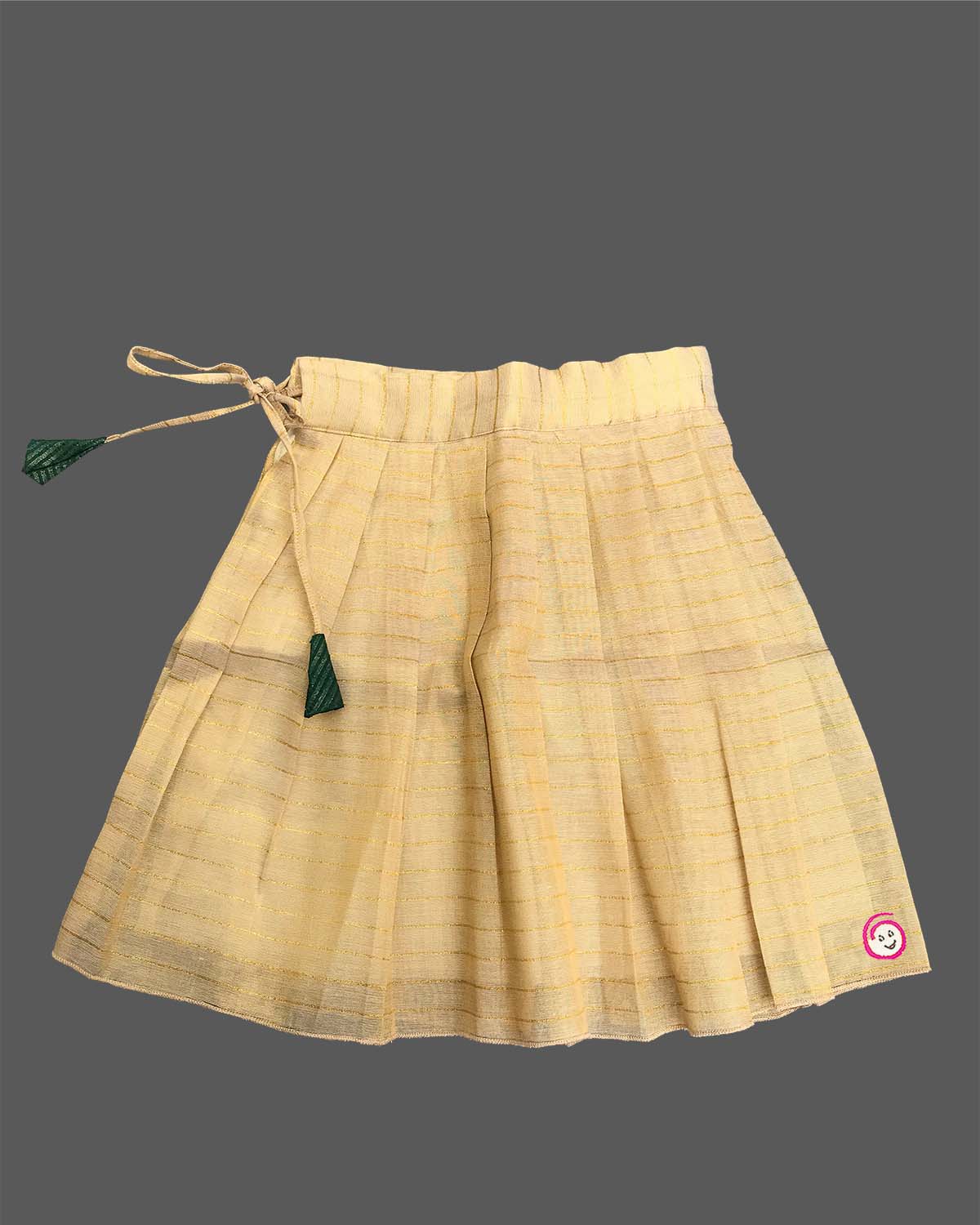 Young fashionista wearing traditional festive two-piece set featuring ribbon rose detail and pleated zari striped skirt.