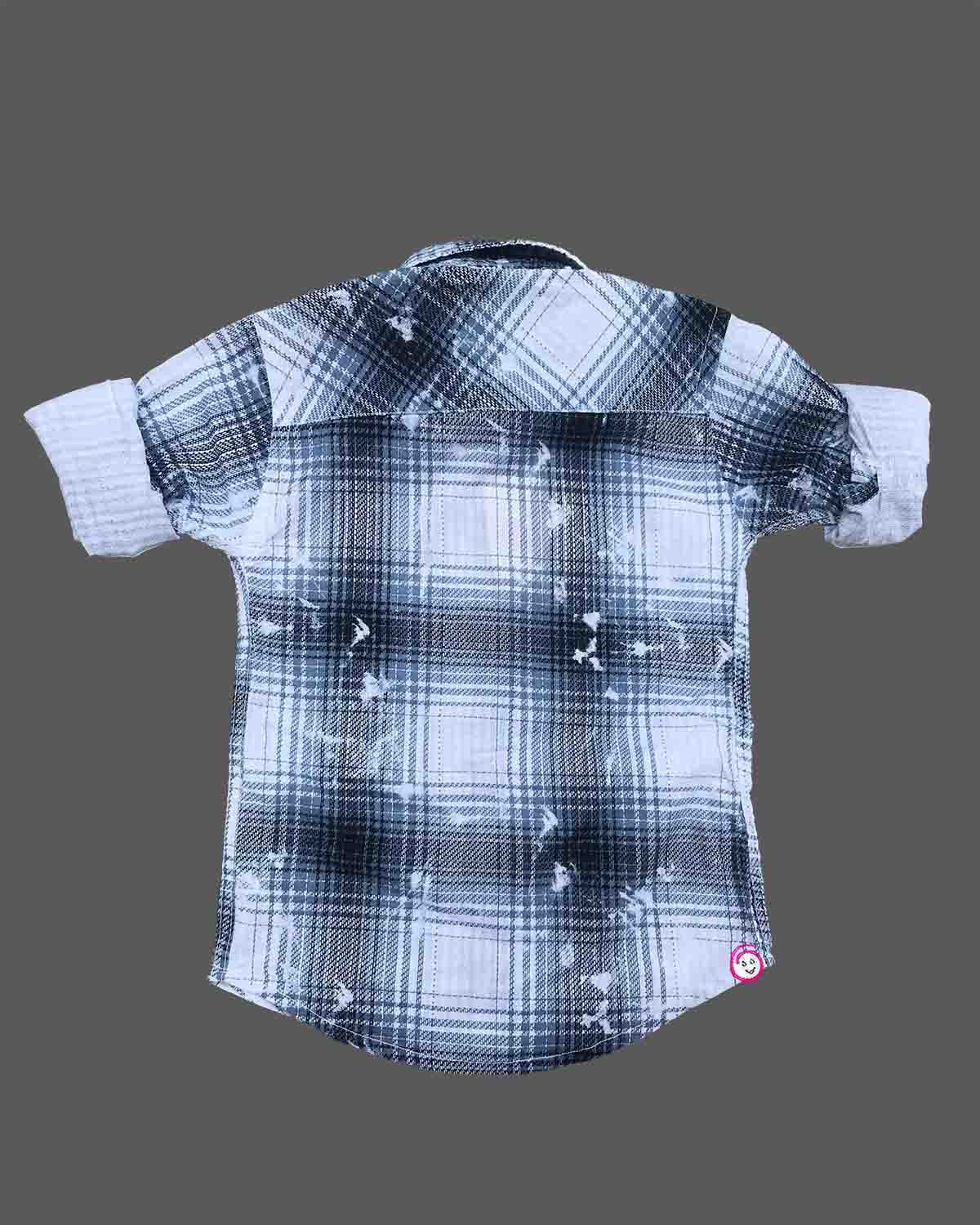 Toddler boy wearing blue and white check shirt with rolled up full sleeves for casual outing