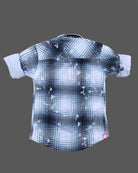 Toddler boy wearing blue and white check shirt with rolled up full sleeves for casual outing