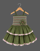 Baby party wear dress with smocked elastic bodice, tiered flared skirt, and delicate lace trim.
