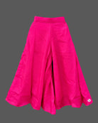 Kids sharara set featuring strappy embroidered top with mirror work trim and wide flared palazzo pants.