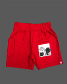 White striped t-shirt with graphic patches and red elasticated shorts baby boy top and shorts set for summer vacations, playdates, and park outings