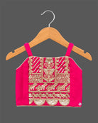 Girls embroidered choli top, flared lehenga skirt, and matching open-front sleeveless jacket.