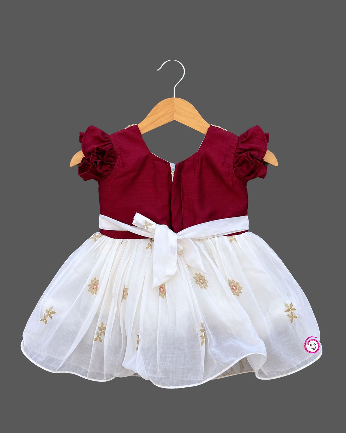 Silk frocks for baby girl with pearl beaded V-neck, flutter sleeves and printed gathered skirt on hanger