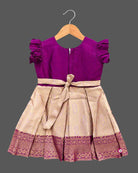 Girls embellished silk frock with embroidered round neck flutter sleeves and pleated zari skirt