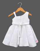 Toddler girl pleated scuba frock featuring oversized fabric rosettes and one-shoulder strap for festive events