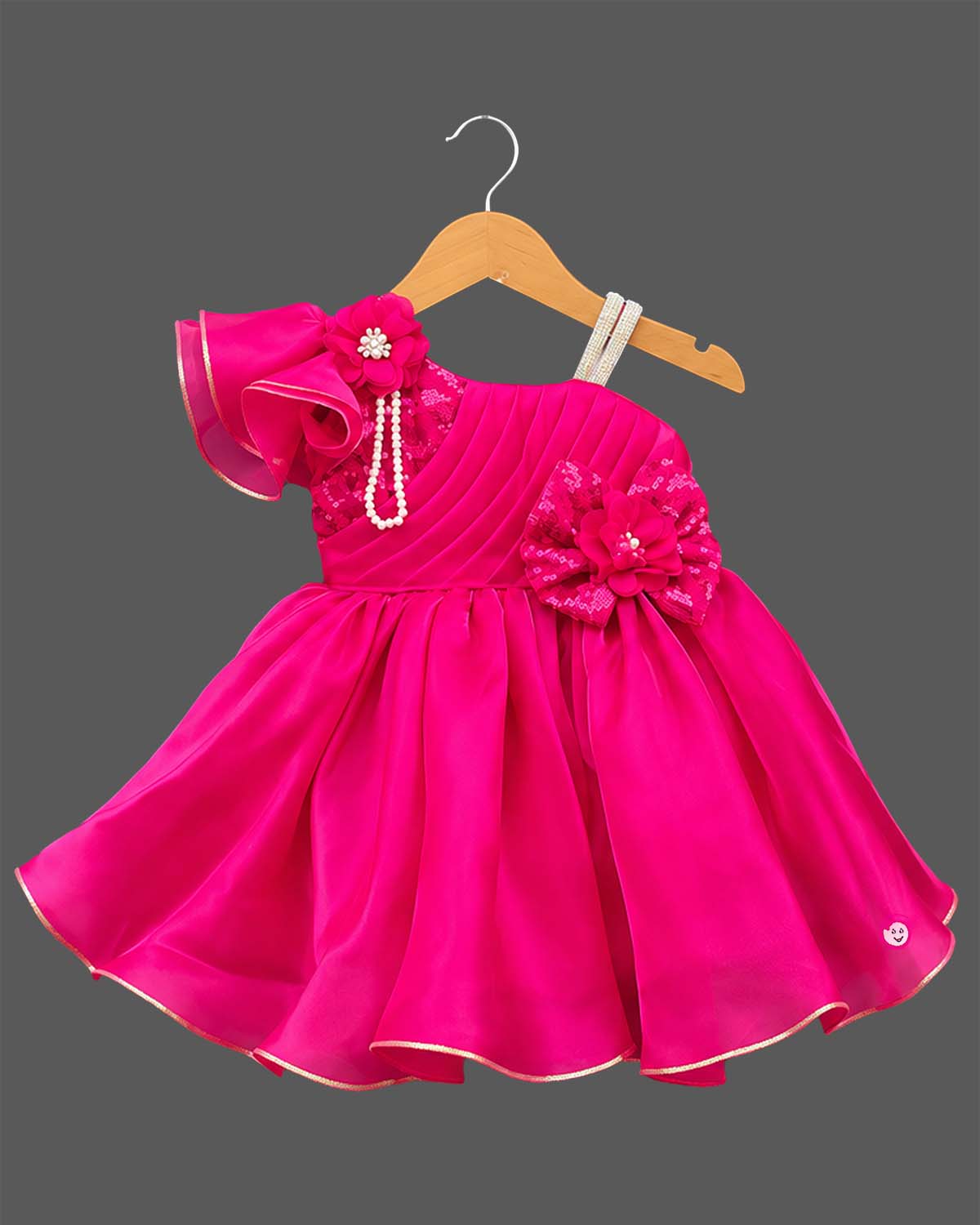 One-shoulder pleated organza baby party wear dress with ruffle sleeve and floral applique.