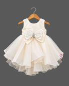 Silk frocks for baby girl featuring multi-layered organza ruffles and a jeweled bow.