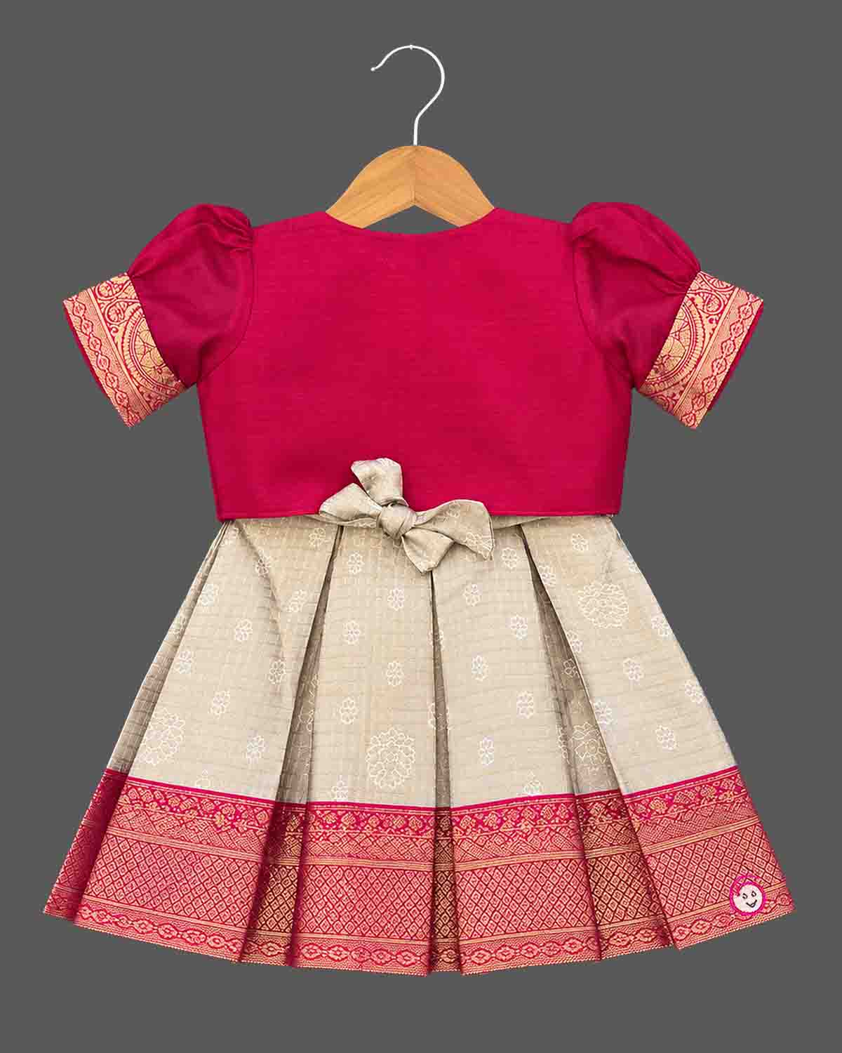 Pattu frock with beaded jacket, puff sleeves, front tassel tie and box-pleated zari border skirt for girls