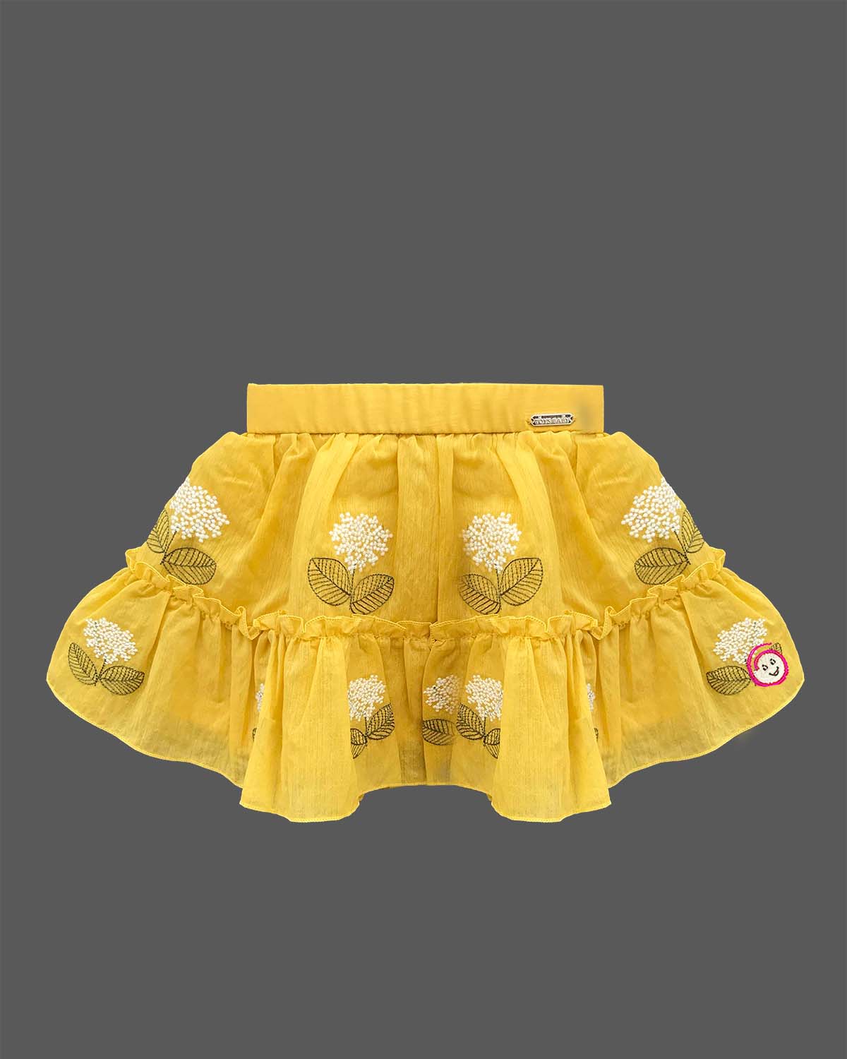 Cap sleeve top with lace flower motifs paired with a tiered embroidered skirt for a young fashionista
