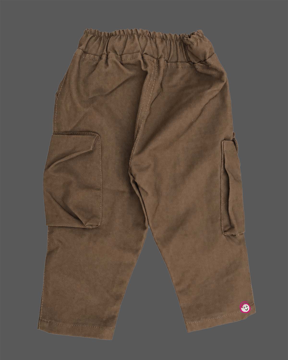 Casual utility cargo pant for young prince designed with dual flap pockets, graphic patch accent, and a thick rope drawstring waistband.