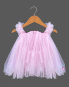 Layered tulle flared silk frocks for baby girl featuring ruffled shoulder straps and dangling floral appliques.