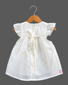 Baby girl cotton frilled frock with embroidered botanical hem and cap sleeves