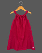 Baby girl lehenga style sleeveless dress with large floral appliques, soft textured weave, and flared silhouette.
