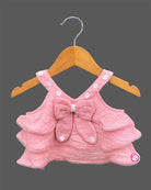 Sleeveless tiered ruffle top with bow applique and embroidered matching shorts for a toddler