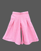 Sleeveless kurti for kids with asymmetric tassel hem and wide-leg pleated palazzo pants.