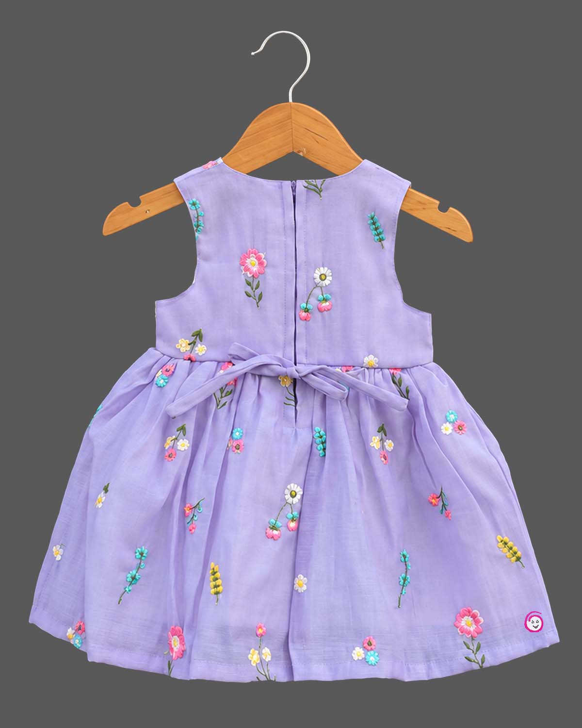 Sleeveless organic cotton frock with embroidered floral details and kurti for kids styling.