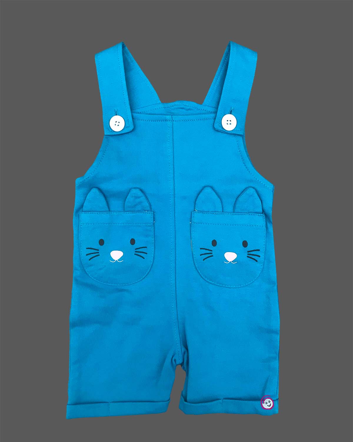 Toddler boy wearing comfortable cotton dungaree shorts featuring cute animal face pockets and a crew neck t-shirt.