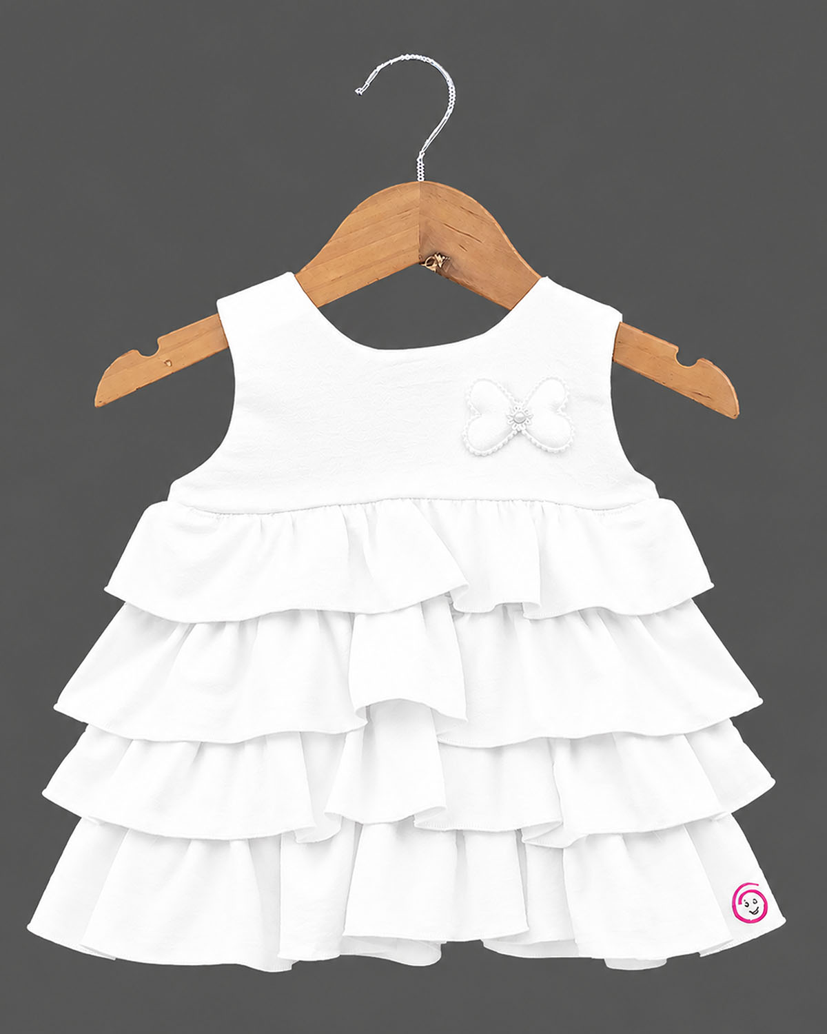White tiered ruffled baby girl party wear frock with butterfly applique for birthdays, weddings, and special occasions