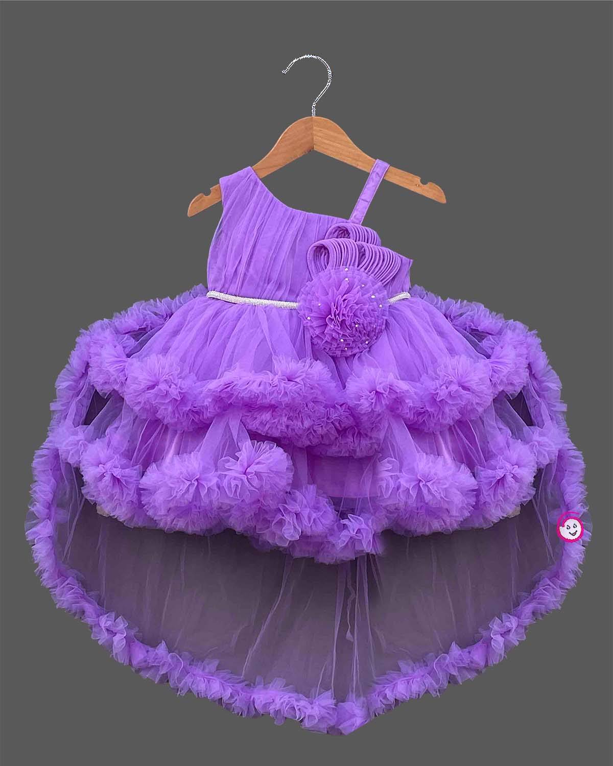 Purple net frock with layered ruffles and floral embellishment for girls