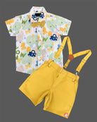 Playful toddler boys dapper outfit featuring a printed button-down shirt, cute bow tie, and matching suspender shorts.