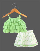 Charming top and skirt set for little princess featuring a multi-tiered ruffled strap top paired with a delicate embroidered net skirt on a hanger.