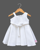 Baby girl scuba frock featuring structured box pleats and dimensional rose appliques for party wear