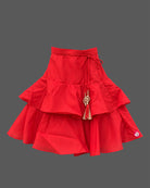 Girls floral embroidered sleeveless choli paired with a tiered ruffled skirt and tassel drawstring accent.
