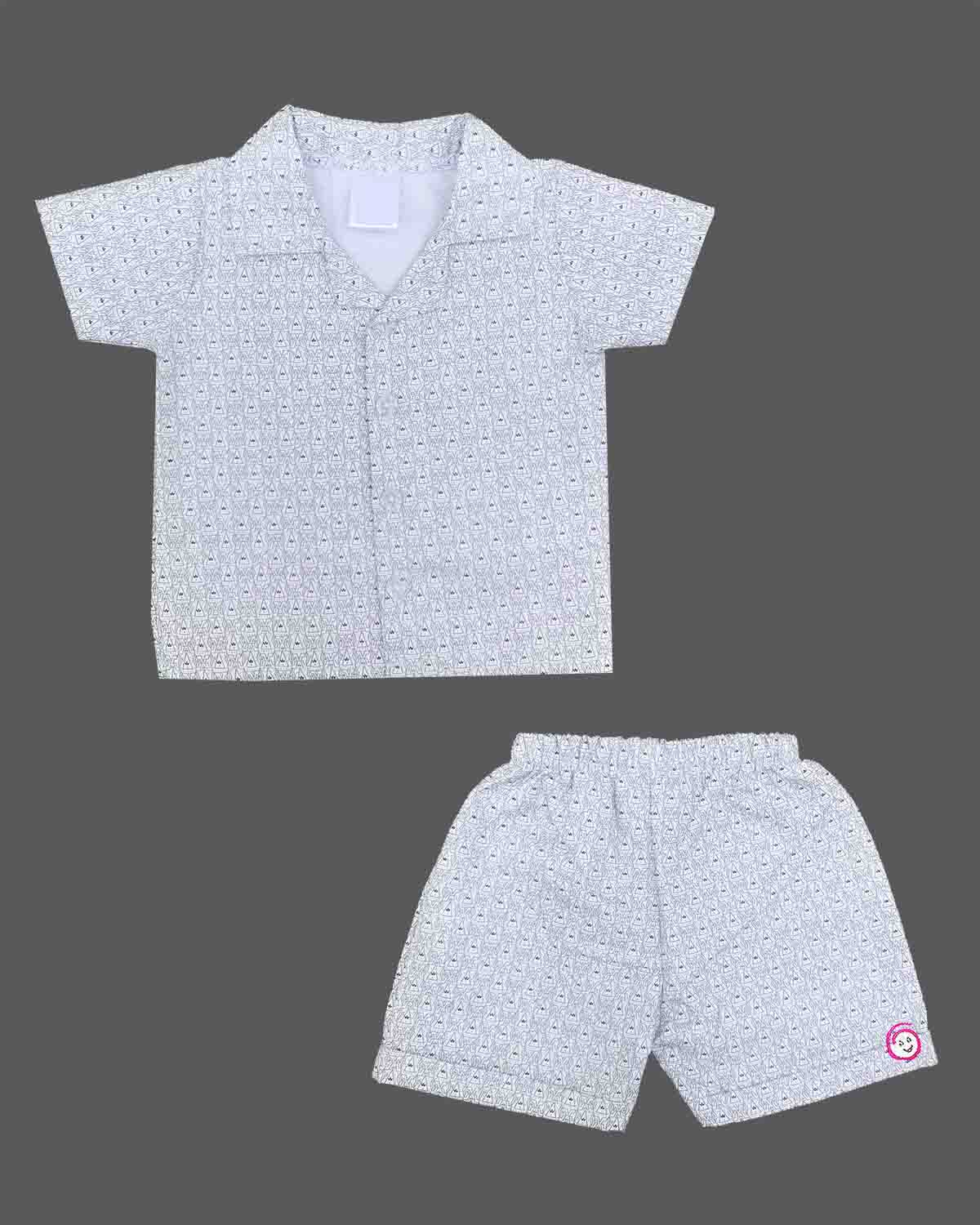 A matching casual shirt and shorts duo for young boys featuring an all-over patterned design and a comfortable elastic waistband.