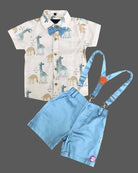 Stylish young prince wearing a collared giraffe print shirt with bow tie and suspender shorts outfit.