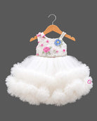 Baby party wear dress featuring floral bodice with tiered ruffle tulle skirt and train