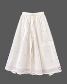 Sleeveless kurti for kids featuring floral embroidery, paired with wide-leg palazzo pants and gold-bordered dupatta.