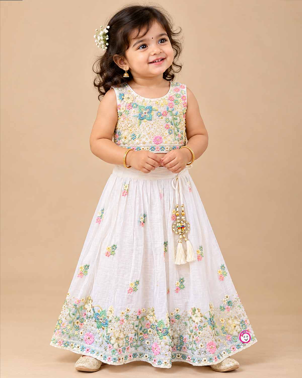 Hand-embroidered lehenga choli for kids with sleeveless choli, flared skirt, and dupatta.