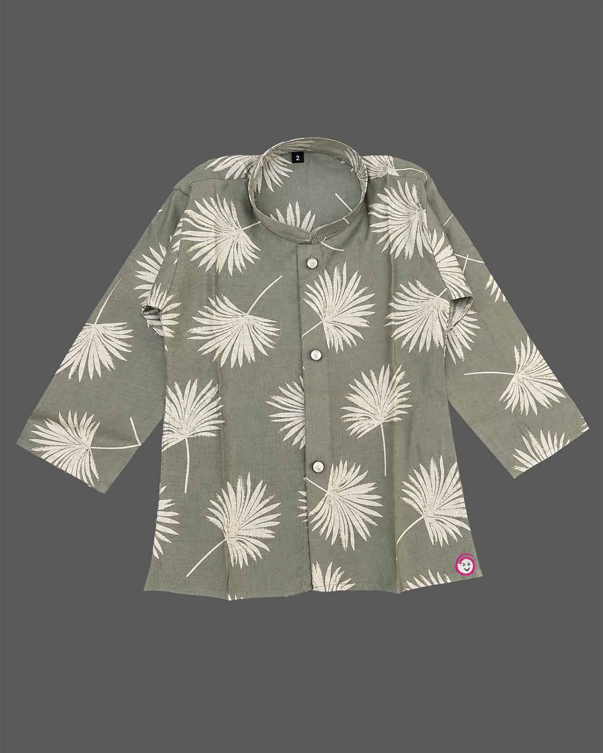 Baby boy ethnic kurta pant set featuring botanical leaf prints, mandarin collar, and roll-up sleeves.